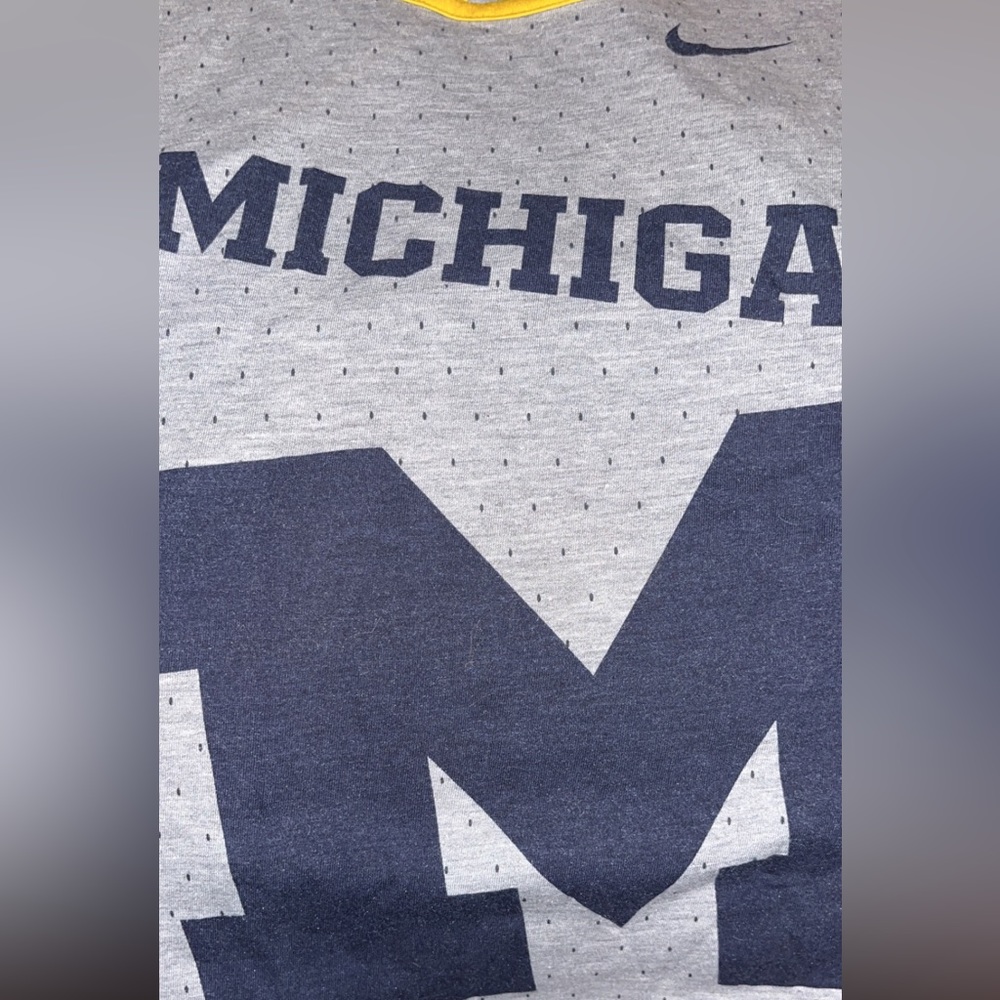 Two workout tanks! University of michigan and university of Miami